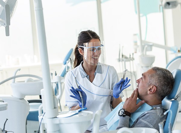 Dentist explaining treatment to patient